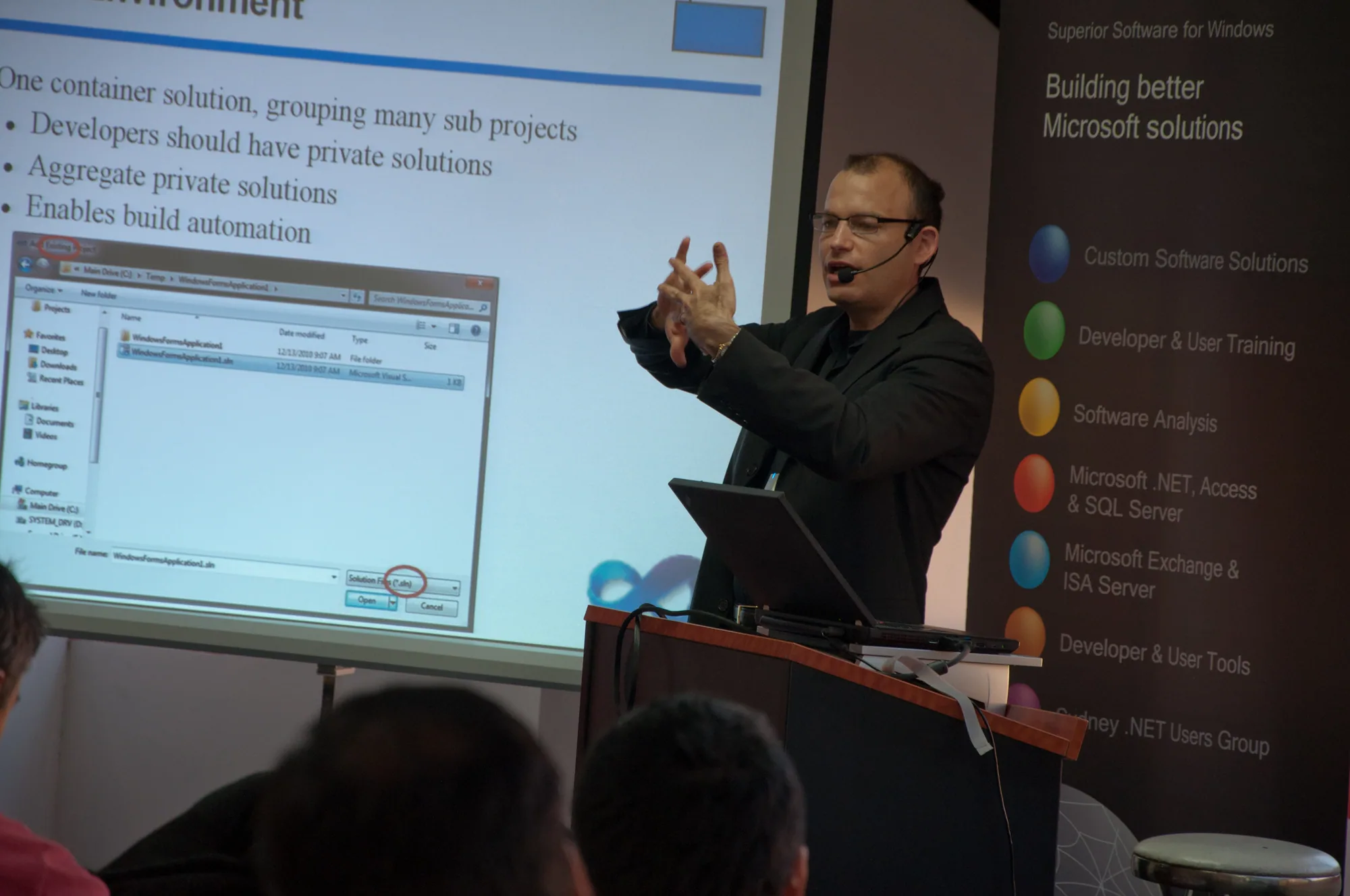 Figure: Juval demonstrating how solutions and projects should fit together (complete with Lady Gaga microphone)