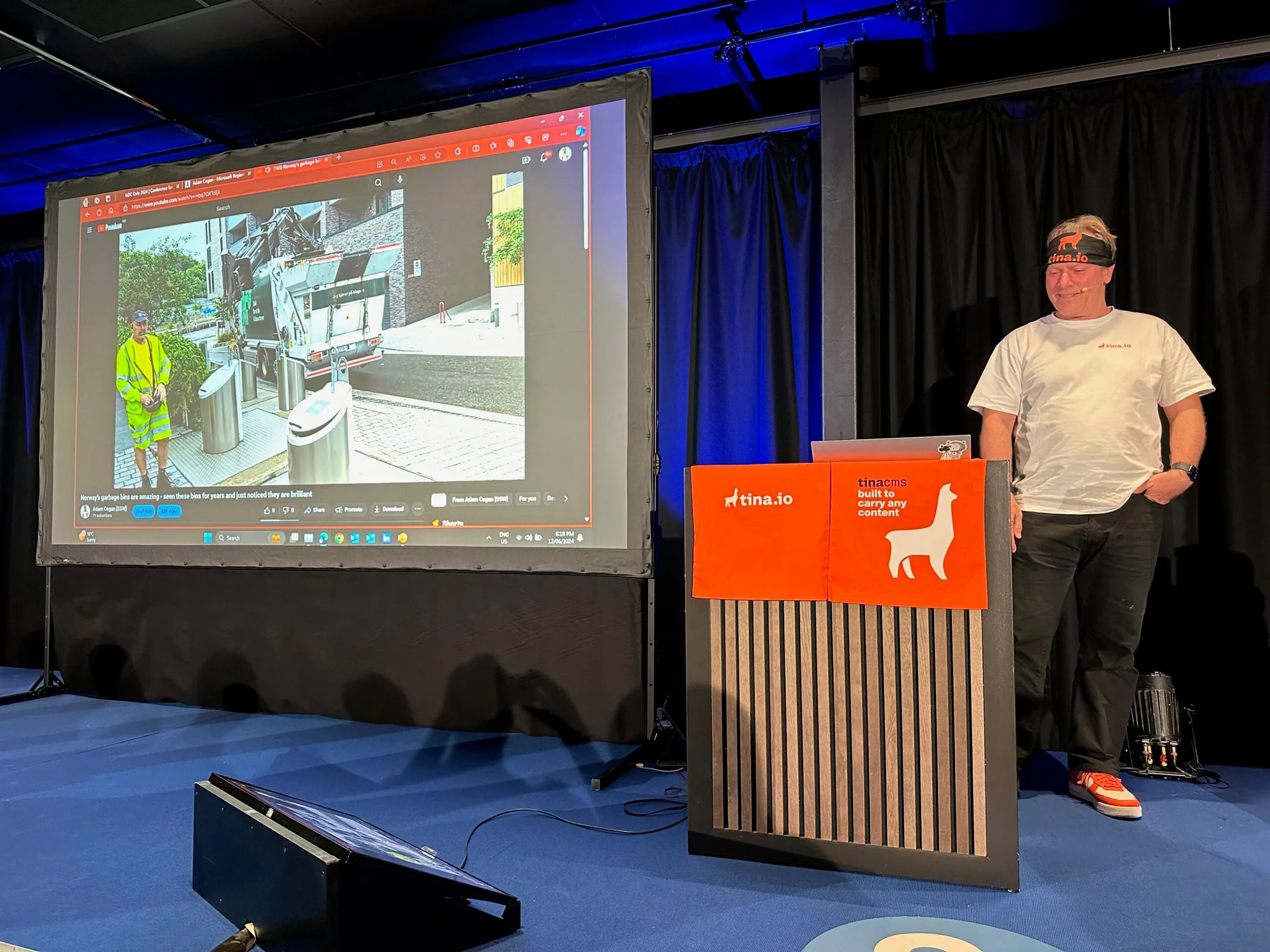 Adam Cogan presenting on stage